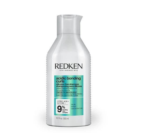 Shampoo Redken Acidic Bonding para reparar, fortalecer y proteger el cabello dañado